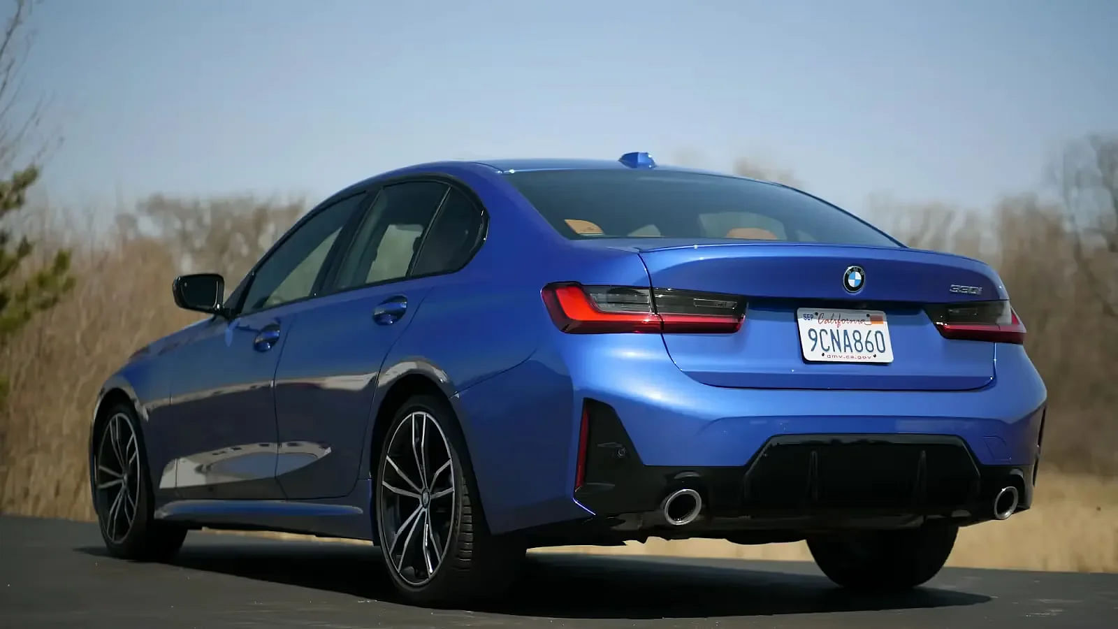 Blue 2024 BMW 330i rear view